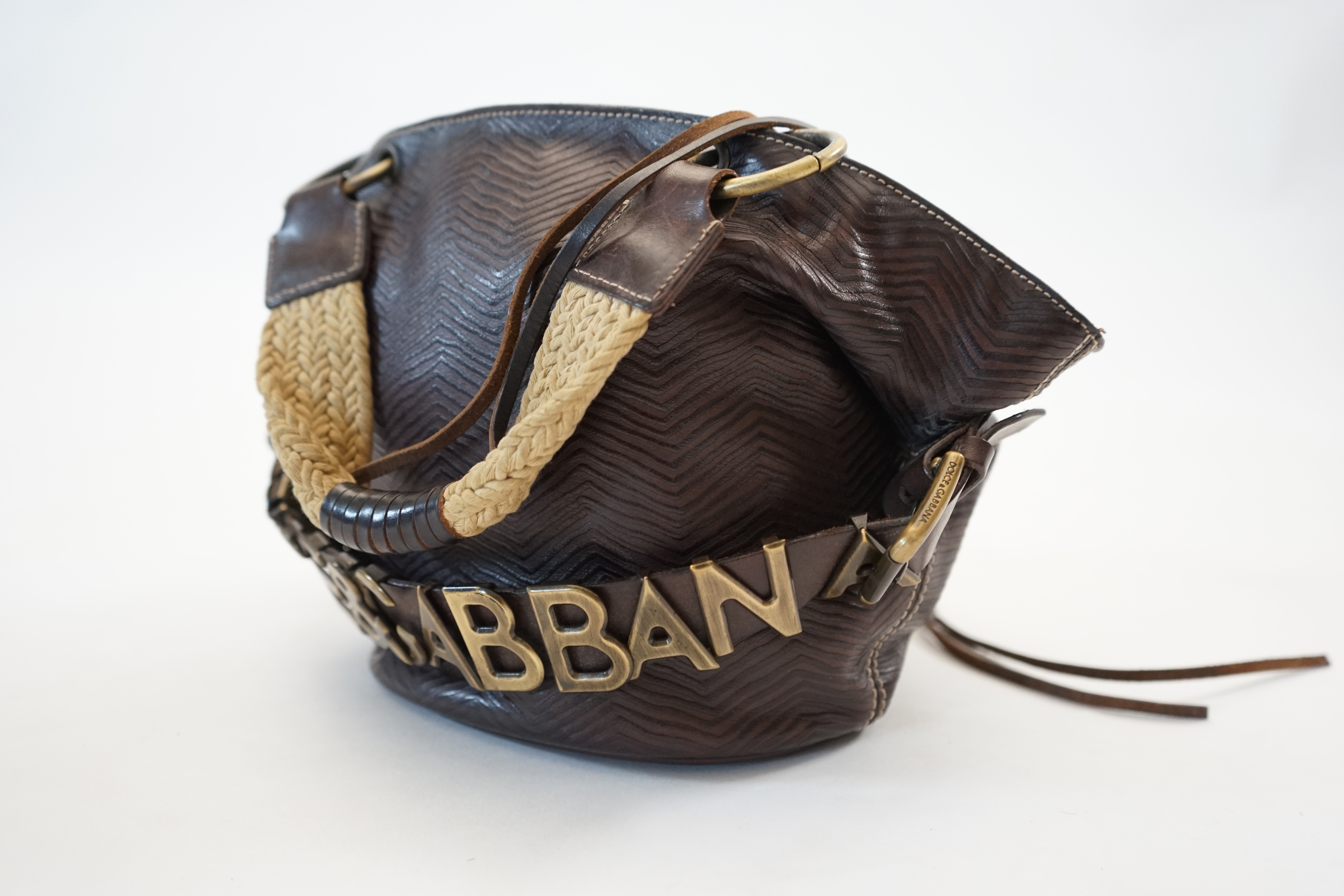 A Dolce & Gabbana brown and black leather bucket bag, width (max) 34cm, depth 14cm, height 20cm